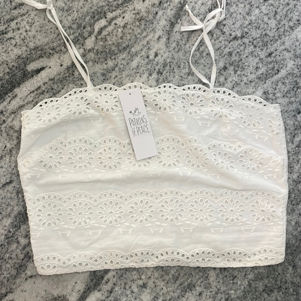 Patron of peace, white eyelet cropped tank.